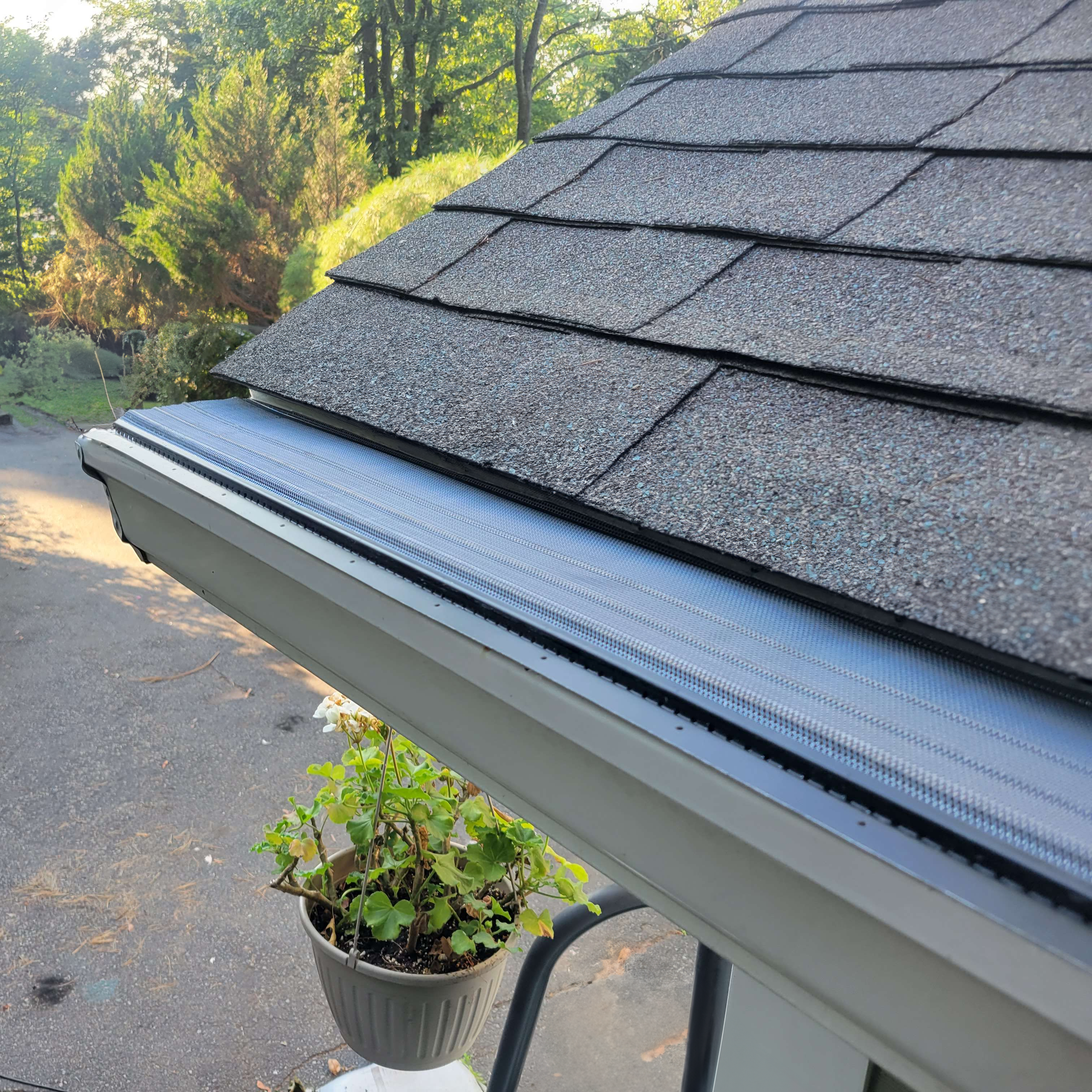 Close-up detail of aluminum mesh gutter guard material and construction